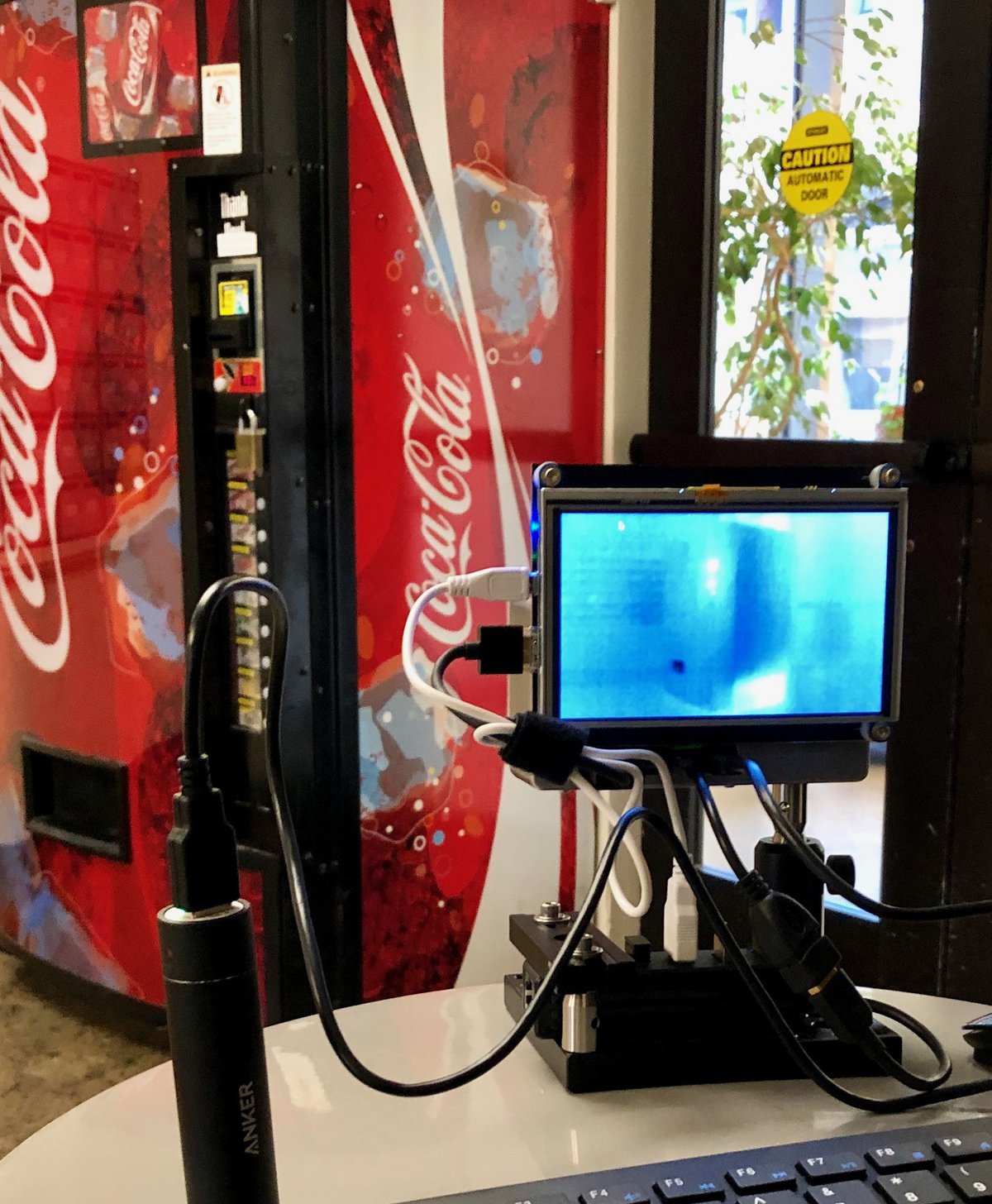 Taking thermal and visible images of a vending machine